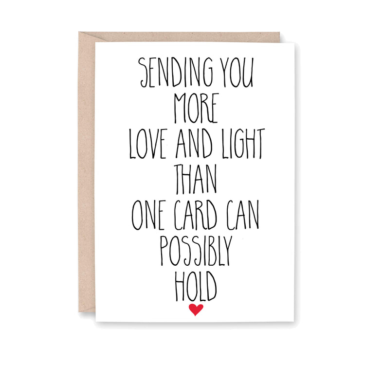 Greeting card that says, "Sending you more love and light than one card can possibly hold" with a small red heart at the bottom