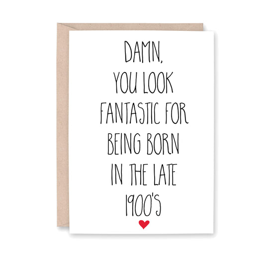 Greeting card that says "Damn, you look fantastic for being born in the late 1900's" with a small red heart at the bottom