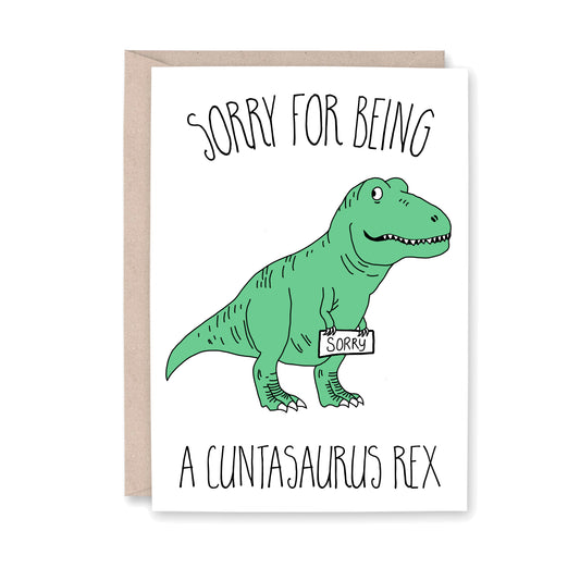 greeting card with an illustration of a green T-rex dinosaur holding a sign that says Sorry.