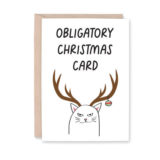 Greeting card with a drawing of a smirking cat with reindeer antlers and an ornament hanging from the antlers. That says Obligatory Christmas Card